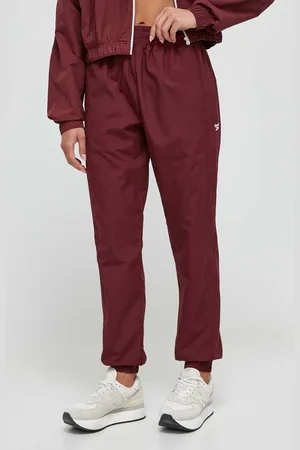 Reebok Tepláky vínová barva, hladké