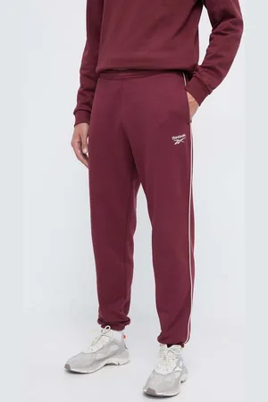 Reebok Tepláky vínová barva, hladké