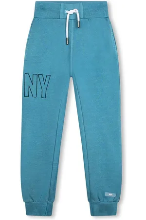 DKNY Dětské bavlněné tepláky zelená barva, s potiskem