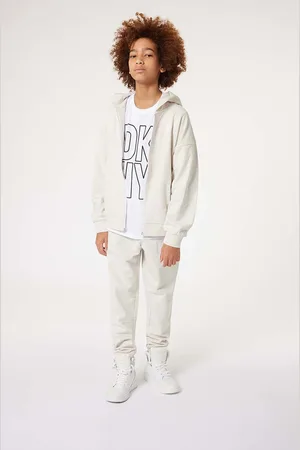 DKNY Dětské bavlněné tepláky barva, s potiskem