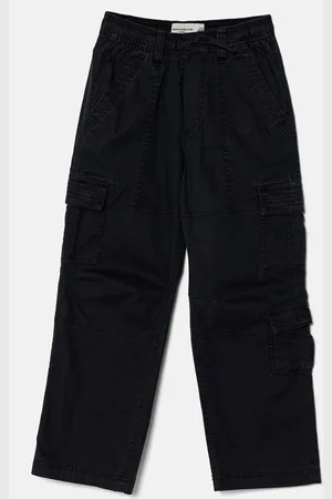Abercrombie & Fitch Dětské kalhoty tmavomodrá barva, hladké, KI230-4013