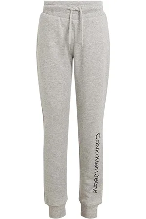 Calvin Klein Dětské bavlněné tepláky REGULAR JOGGER barva, s potiskem, IU0IU00604
