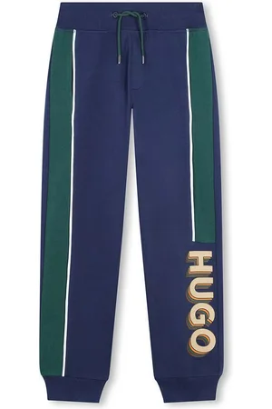 HUGO BOSS Dětské tepláky tmavomodrá barva, s potiskem, G00183