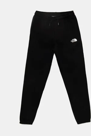 The North Face Dětské tepláky TEEN REGULAR TAPERED JOGGERS barva, hladké, NF0A8BHTJK31