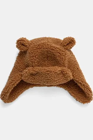 UGG Dětská čepice FLUFF TRAPPER barva, z husté pleteniny, 101500