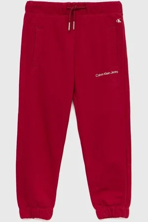 Calvin Klein Dětské tepláky růžová barva, hladké
