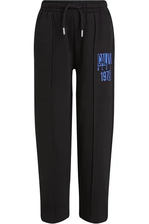 Calvin Klein Dětské bavlněné tepláky barva, s potiskem, IB0IB02483