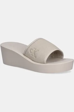 Calvin Klein Pantofle BEACH WEDGE SLIDE CANVAS dámské, barva, na klínku, YW0YW01725