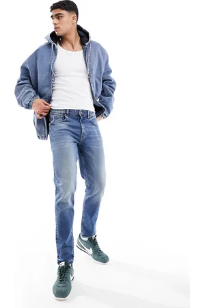 ASOS Stretch tapered jeans in mid wash