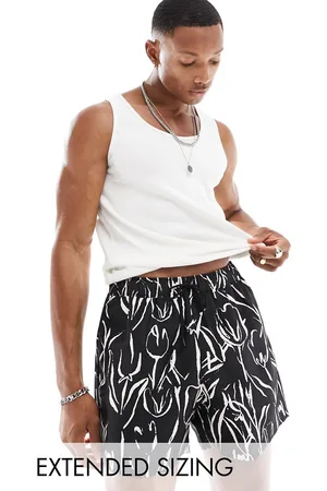ASOS Swim shorts in short length in and white floral print