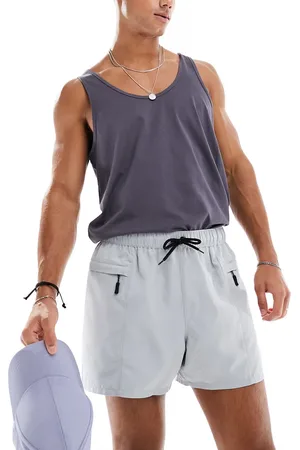 ASOS Swim shorts in short length with zip pocket and black drawcord in