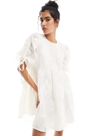 & OTHER STORIES Mini smock dress with tie detail volume sleeves in jacquard