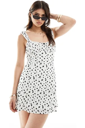Bershka Bow detail milkmaid mini dress in ecru floral