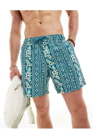 ASOS Swim shorts in mid length in tropical stripe print