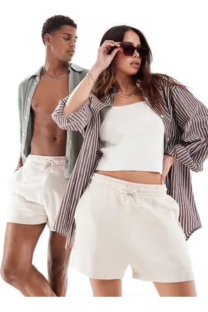 ASOS Unisex shorter length slim shorts in washed beige