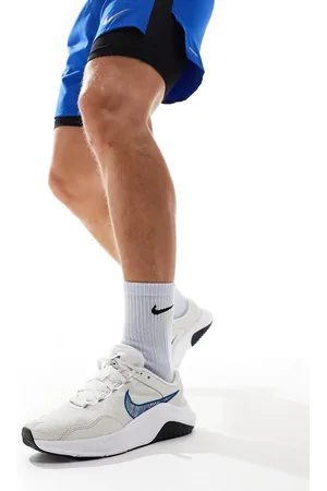 Nike Legend Essential 3 trainers in and blue
