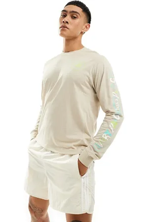 adidas Adidas Running Own The Run long sleeve top with graphic in beige