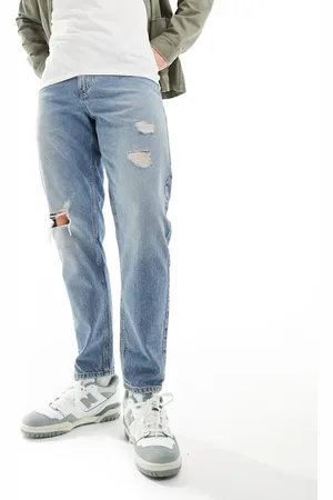 ASOS Tapered fit jeans with rips in light wash - MBLUE