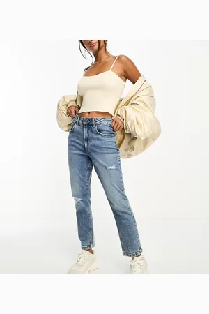 ASOS ASOS DESIGN Petite slim fit comfort mom jeans with rip in mid