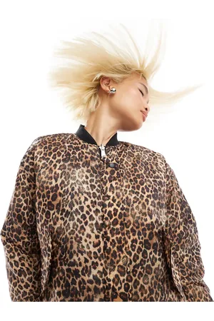 Monki Reversible oversized bomber jacket in black quilted star and leopard print