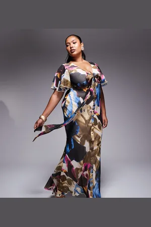 ASOS ASOS DESIGN Curve exclusive flutter sleeve midi dress with tie detail in abstract print