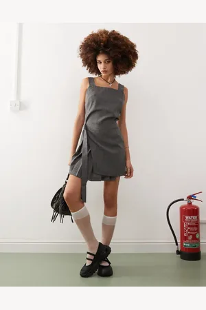 COLLUSION Kilted mini pini dress with buckle detail in