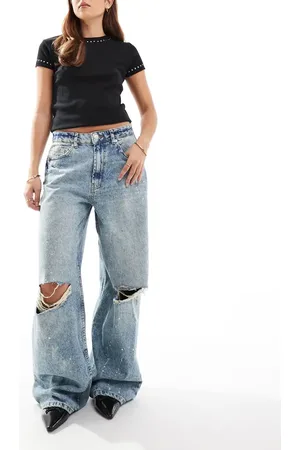 ASOS Baggy jeans with rips and paint splats in mid