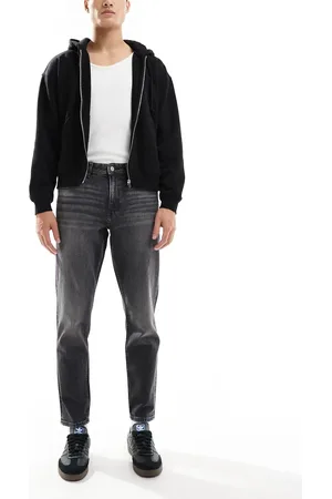 ASOS Stretch tapered jeans with vintage tint in washed