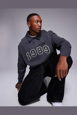 ASOS Boxy oversized polo sweatshirt with applique print in charcoal