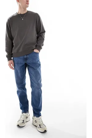 ASOS Stretch tapered jeans in mid wash