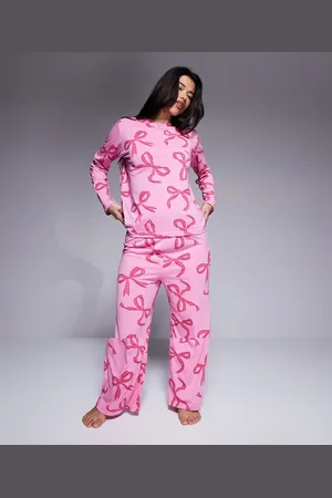 In The Style Pyjama long sleeve top and trousers set in bow print