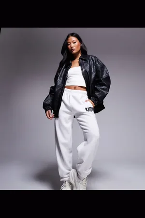 Kaiia Studio Petite cuffed wavy logo joggers in cream and black