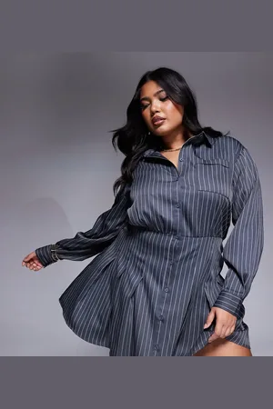 In The Style Plus x Natalya Wright exclusive tailored pleated mini shirt dress in charcoal pinstripe