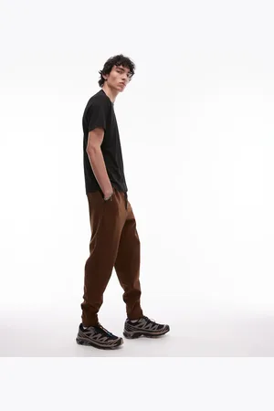 MANGO Performance breathable slim joggers in rust