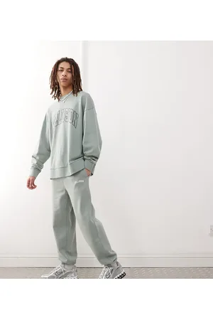 COLLUSION Varsity joggers co-ord in with print