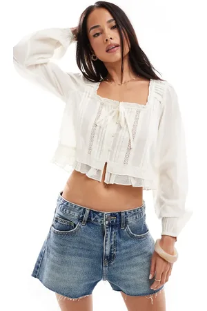 Stradivarius Ruffle tie front long sleeve top in
