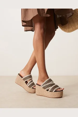 ASOS Thistle whipstitch detail wedge mules in natural and black
