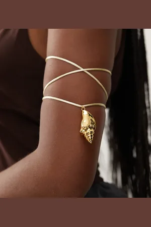 En Route 18k plated circe cord arm cuff with shell pendant