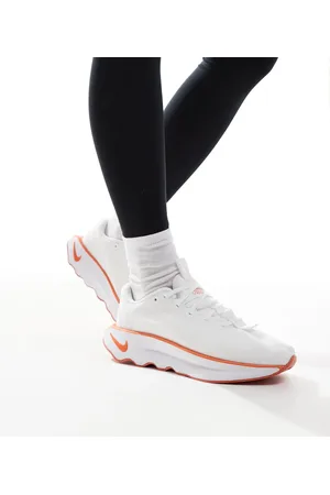 Nike Motiva trainers in and orange