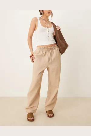 ASOS Tailored textured drawstring waist arch leg trousers in stone