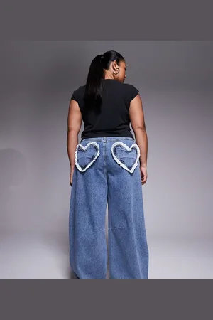 ASOS Curve barrel leg heart pocket jeans in midwash