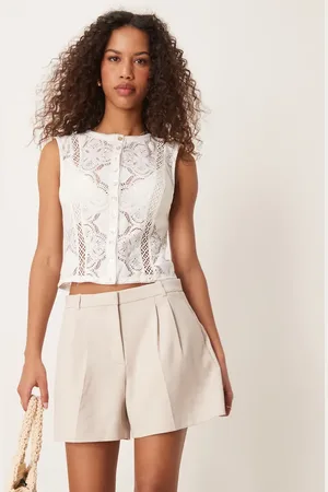Abercrombie & Fitch Curve mid rise pleated sloane shorts in beige