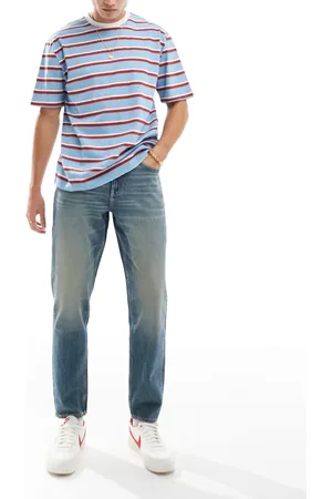 ASOS Tapered fit jeans with vintage tint in mid wash