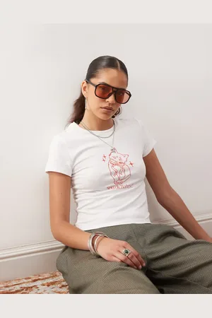 Noisy May Baby tee with cat graphic in