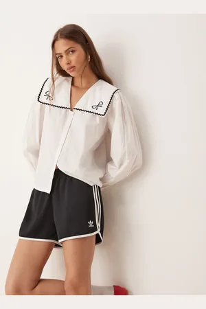 adidas Three stripe sprinter shorts in
