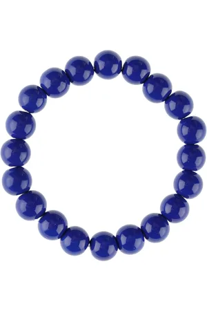 Yups Bead bracelet on an ink eraser