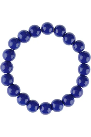 Yups Bead bracelet on an ink eraser