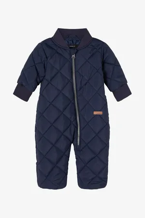 NAME IT Tmavě modrá dětská prošívaná kombinéza Manel - unisex