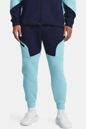 Under Armour Modré sportovní tepláky UA Unstoppable Flc Joggers