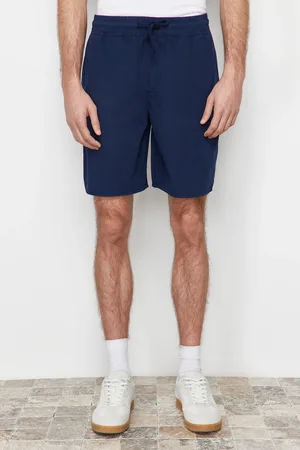 Trendyol Námořnicky modré šortky regular fit s papírovým dotykem Bermuda